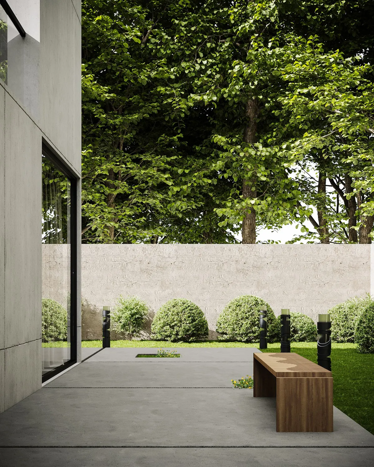 Plain concrete patio with a wooden bench beside a garden