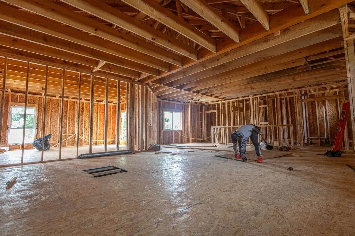 House framing standing on a concrete slab foundation in The Colony, Texas